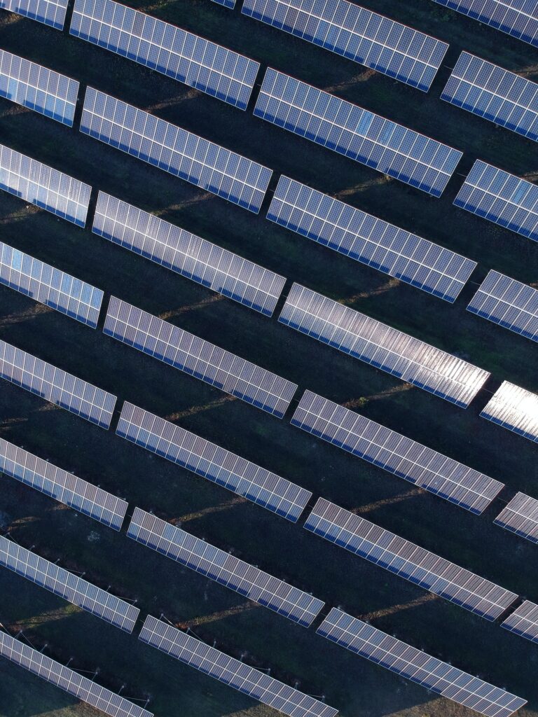 Aerial photo of solar power plant. Many solar energy panels in countryside from above